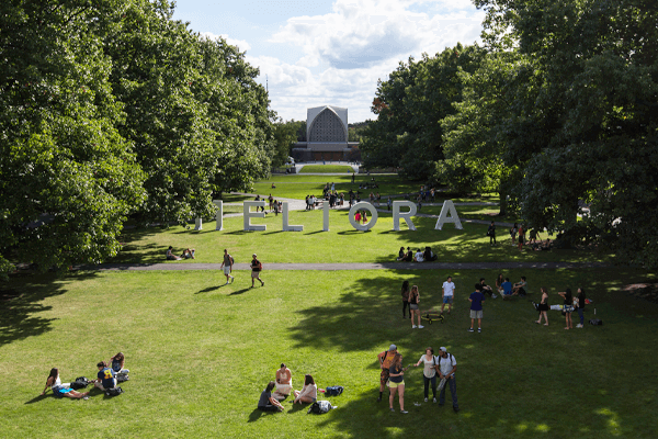 Students on the Quad with the Meliora Sign in the Background